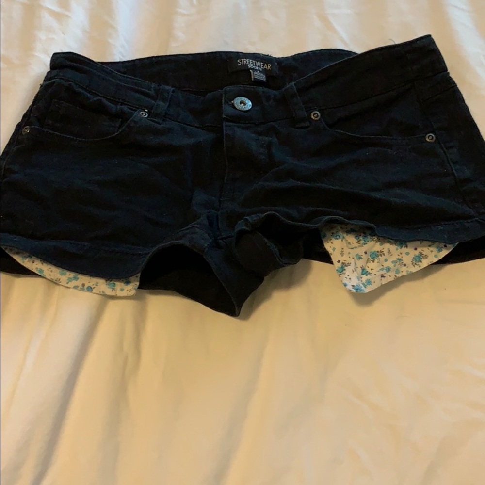 Black shorts with floral pockets